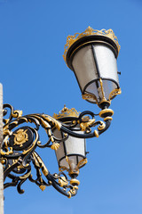 Fototapeta na wymiar Decorative lamp near the royal palace in Madrid, Spain