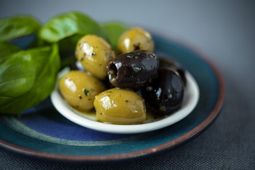 Cured green and black olives