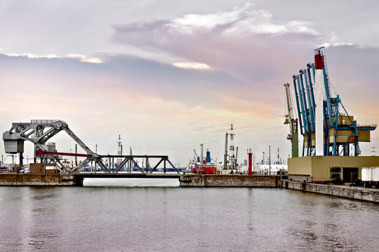 Cargo sea port. Sea cargo cranes. Bridge and marine gateway.