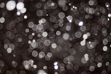 snow bokeh texture on black background