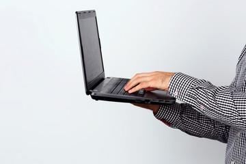 Side view portrait of a man using laptop