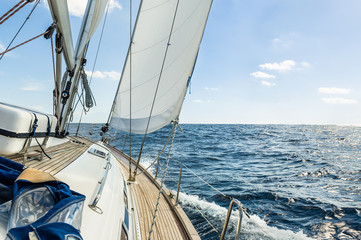 Yacht sail in the Atlantic ocean at sunny day cruise - obrazy, fototapety, plakaty
