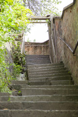 Fototapeta na wymiar Old, uneven, stone staircase, selective focus