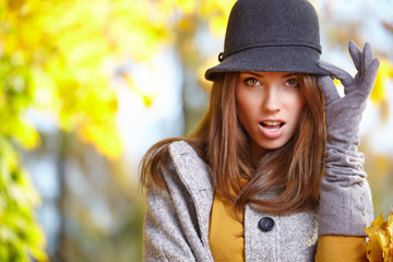 Fashion woman walking in autumn park