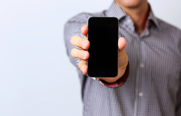 Closeup portrait of a male hands holding smartphone