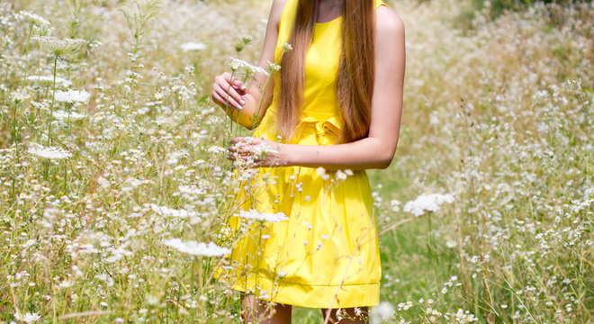 Girl on the flower meadow