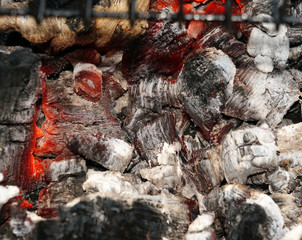 Glowing embers in the ash closeup