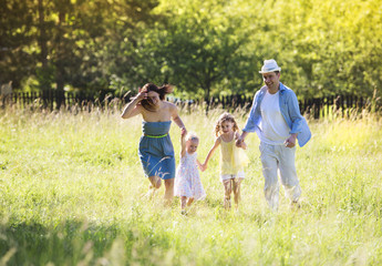 Obraz premium Happy family in nature