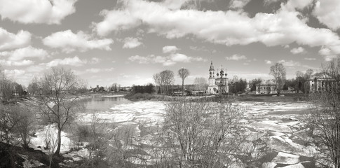 Ice drift on the river in Russia, the church on the shore, the i