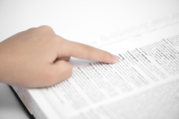 Learning word pointed by finger, education concept.