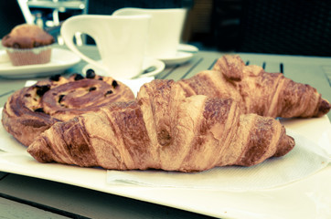 Breakfast with coffee and croissants