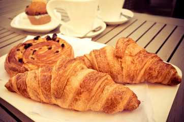 Breakfast with coffee and croissants