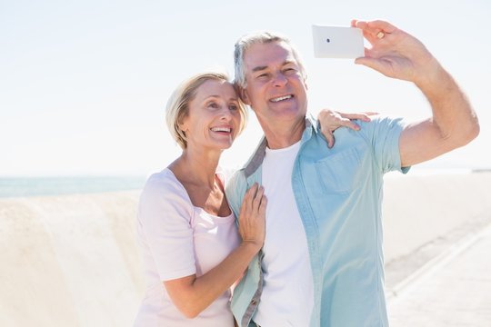 Happy Senior Couple Posing For A Selfie