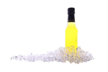Liquor bottle and ice cracked on white background.