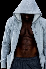 Obraz na płótnie Canvas Muscular young man in hood jacket