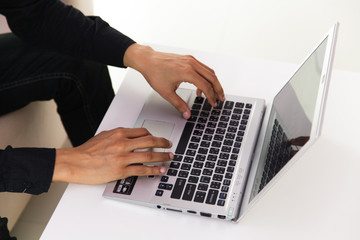 Fototapeta na wymiar hands typing on laptop keyboard