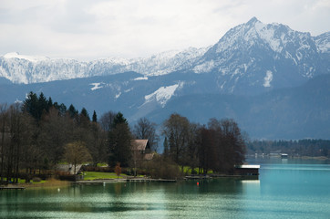 Village with Alps range and lake background