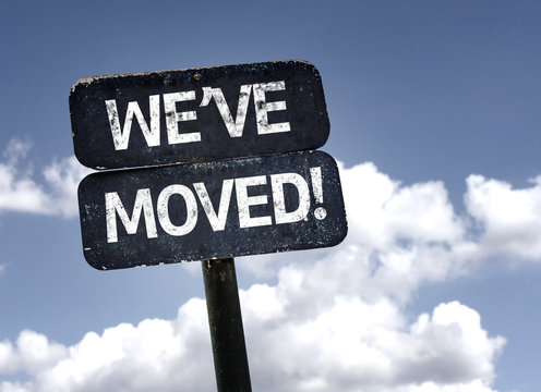 We've Moved! sign with clouds and sky background