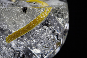 Gin tonic cocktail on black background
