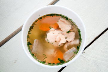 fish soup with salmon in bowl