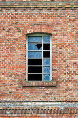 Old factory window with broken glass