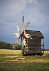 Fototapeta na wymiar Old wooden windmill