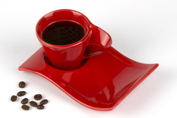 Cup of black coffee and coffee beans