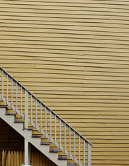 Fototapeta premium Yellow Wall with Stairs