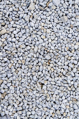 White sharp pebble on the small garden ground