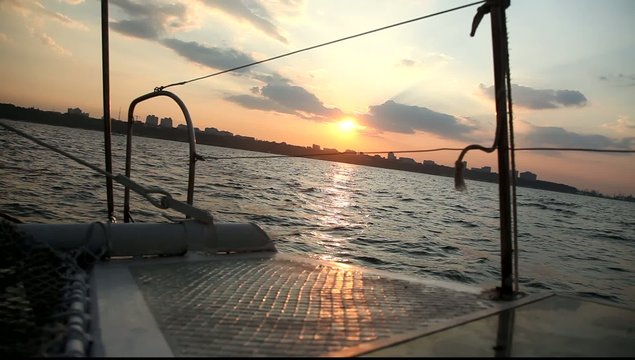 View from deck of a yacht on the sea in sunset time