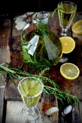 Green estragon lemonade pitcher a wooden table