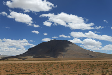 Lonely mount shadowed by clouds