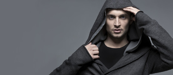 Handsome young man in a hood