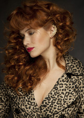 Sexy red hair girl wearing pantera coat © Anna Huzarska