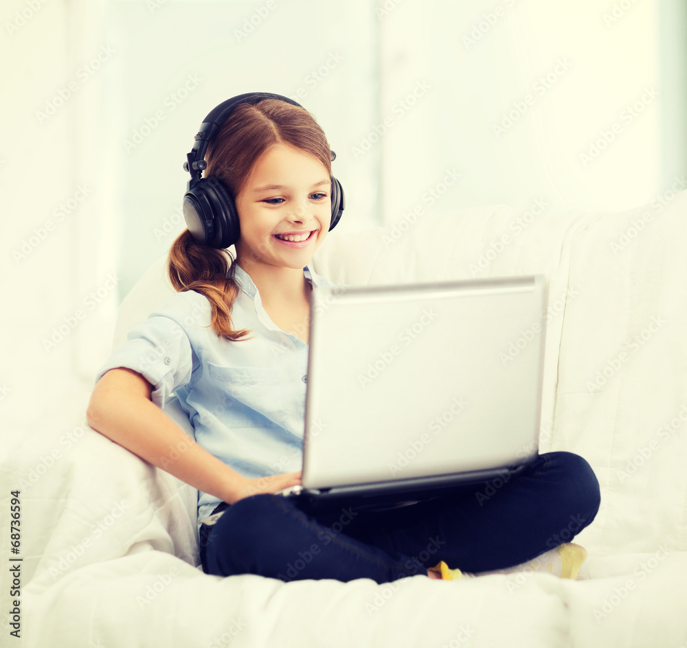 Canvas Prints girl with laptop computer and headphones at home