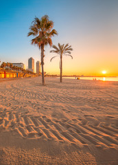 Obraz premium Barceloneta Beach in Barcelona at sunrise
