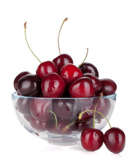 Ripe cherries in a glass bowl