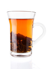 Hot Tea with Tea Leaves in Glass Cup