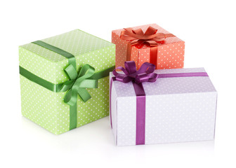 Three colorful gift boxes with ribbon and bow