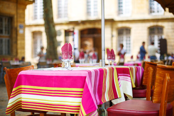 Street view of a cafe terrace with empty tables and chairs, Prov