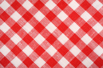 Red and white plaid fabric. Background and texture.