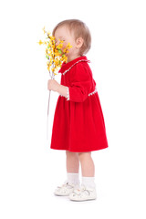 Fototapeta na wymiar Happy little girl with yellow flower isolated over white backgro