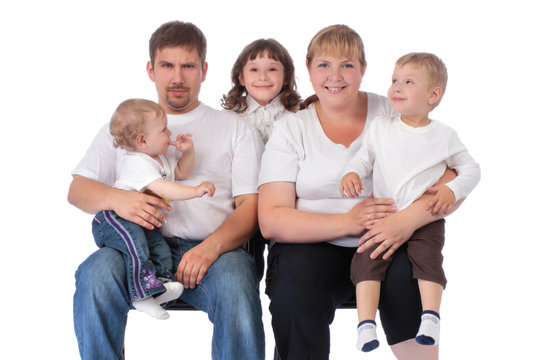 Portrait of beautiful smiling happy family of five - isolated ov