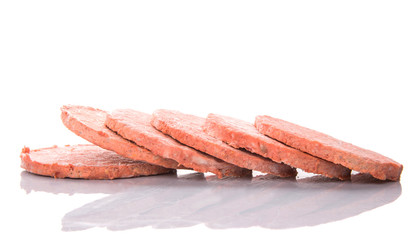 Frozen raw hamburger beef meat over white background