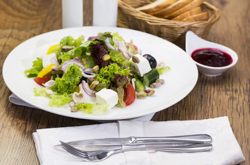 Greek salad on a white background in the restaurant