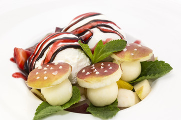 fruit salad and ice cream on white background