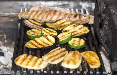 cooking vegetables on the grill in the kitchen at the restaurant
