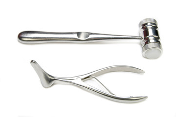steel surgical instruments on a white background