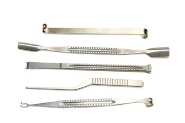 steel surgical instruments on a white background