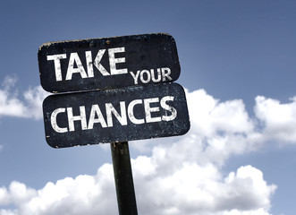 Take Your Chances sign with clouds and sky background